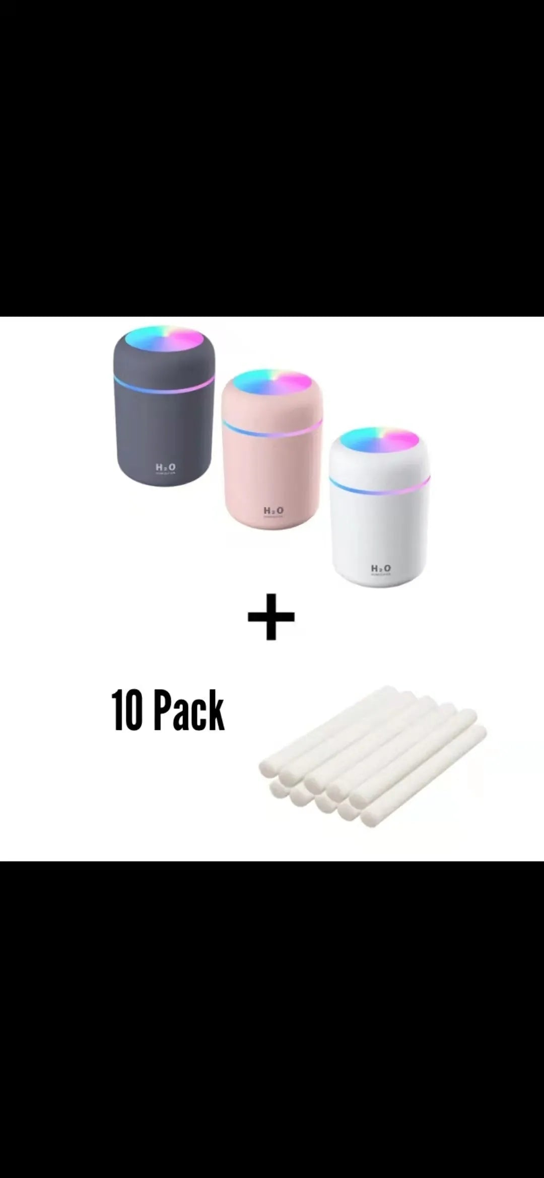 Pink USB portable humidifier with 300ml water tank on wooden desk surface