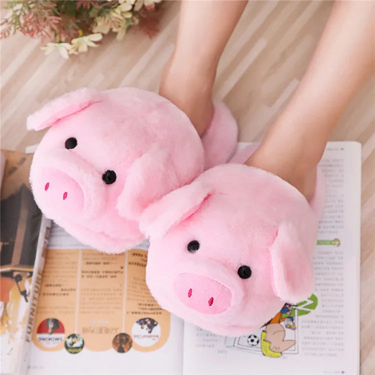 Pink pig design floor slippers with plush lining shown from side view