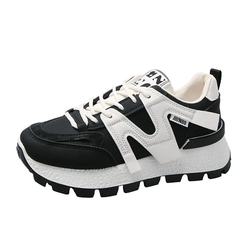 Low-top lace-up sneakers with artificial PU upper and rubber sole in black or white colour