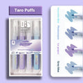 Four glitter highlighter pens with pastel colours and slanted tips on a notebook.