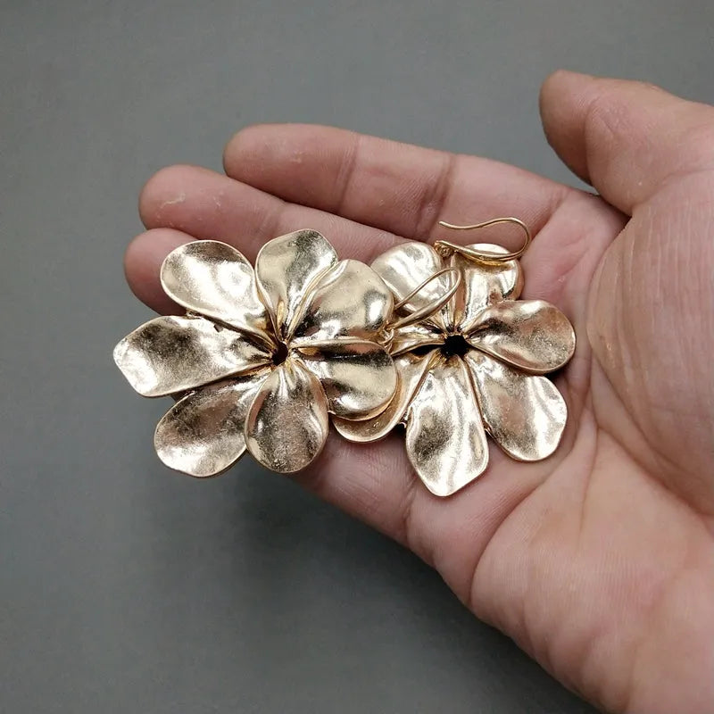 Vintage-style distressed leaf earrings for women in alloy, original silver colour finish on a plain background
