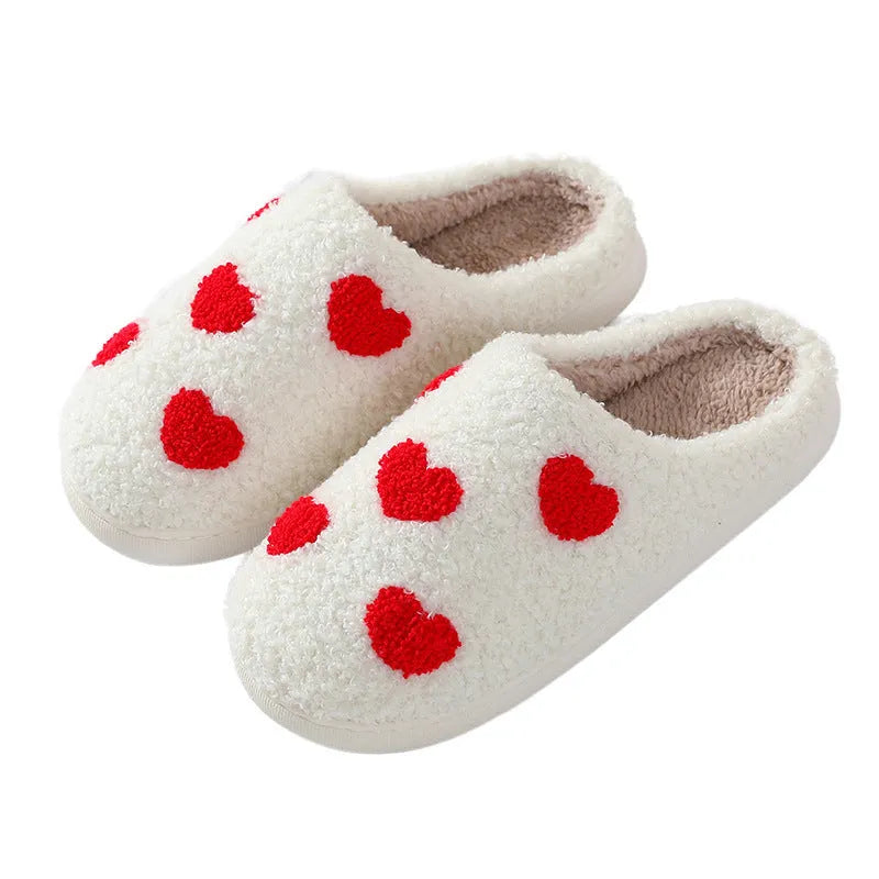 Plush home slippers with cartoon designs and non-slip PVC soles in adult female sizes