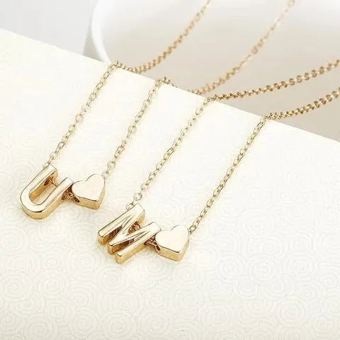 Gold and silver alloy peach heart shaped letter pendant necklace on a chain
