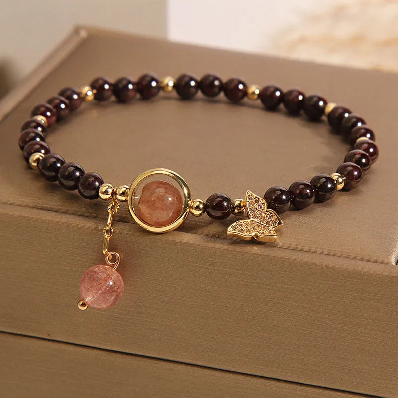 Black stone micro inlay butterfly pendant bracelet on wrist