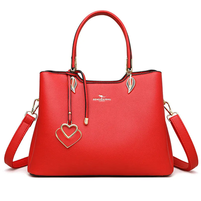 Women's black PU leather shoulder messenger bag with multi-layer compartments and visible stitching details