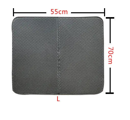 Double layer EVA cat litter mat in black with textured surface, placed under a litter box to trap debris