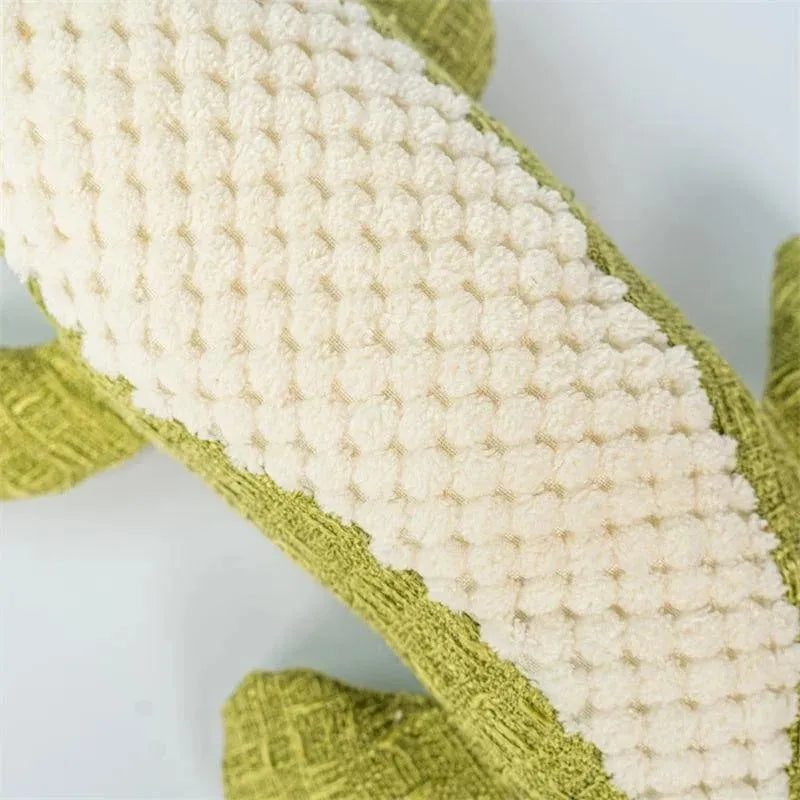 Blue corn-shaped plush dog toy with grid texture on a white background.