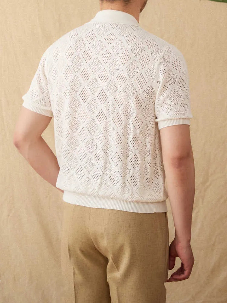Light brown cotton short sleeve cardigan with lapel collar and front zipper closure on hanger