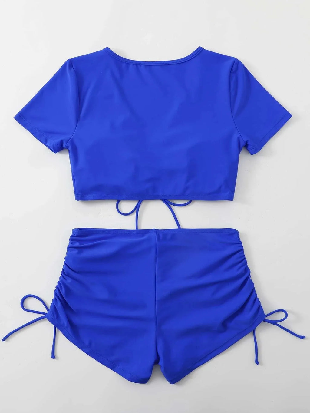 Women's two-piece swimsuit with lace-up front and bow detail in dark green.