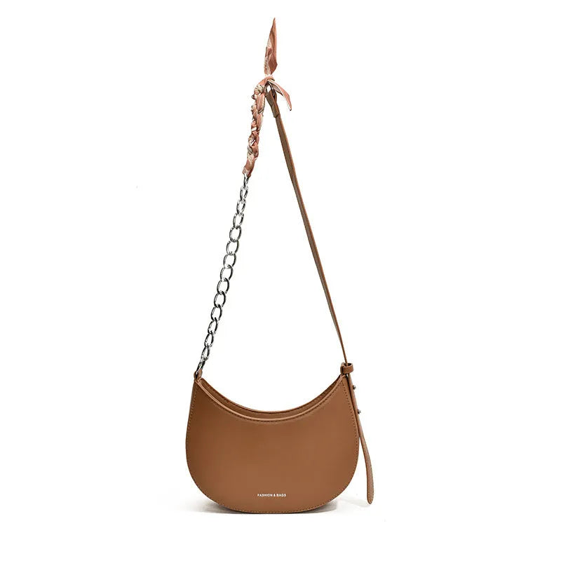 Small PU leather saddle bag on a flat surface, available in black, brown, coffee, green, khaki, and white
