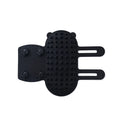 Silicone cat grooming comb with adjustable strap mounted on a table leg, shown in green colour.