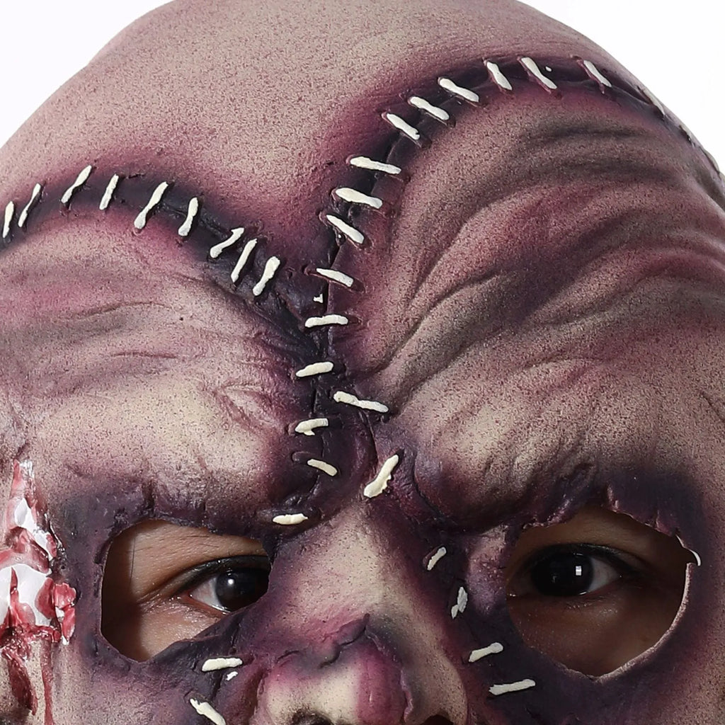 Three-sided grimace horror mask showing three distinct grotesque faces in natural latex