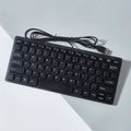 Compact wired USB keyboard in blue colour showing 280mm width and noiseless keys