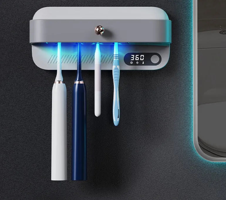 White wall-mounted smart toothbrush steriliser unit with UV disinfection and USB charging port.
