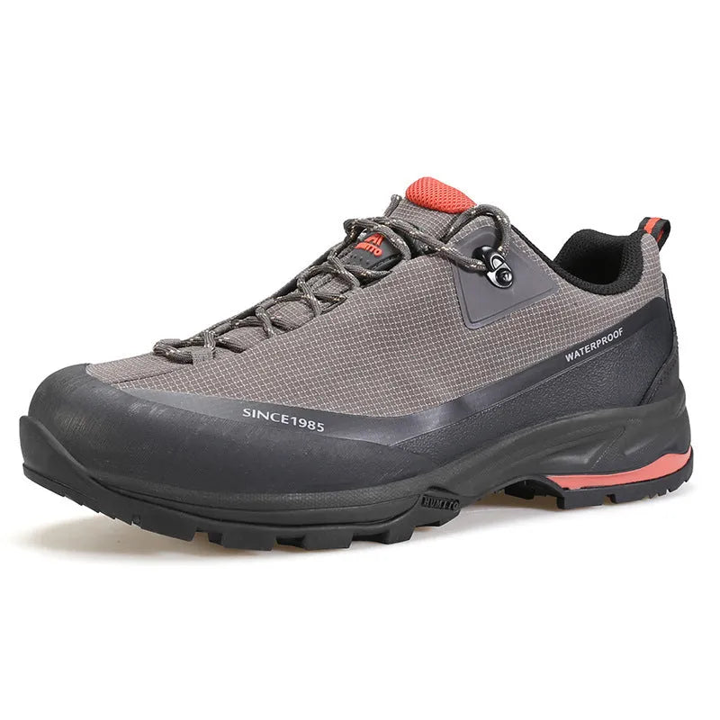 Men's low-top hiking boot in black with front lace-up, rubber outsole, and leather mesh upper.