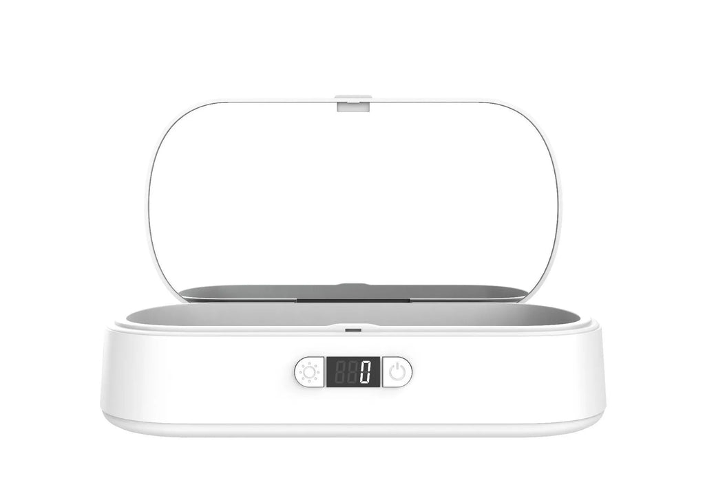 White portable UV steriliser and wireless charging box with aromatherapy function on a desktop
