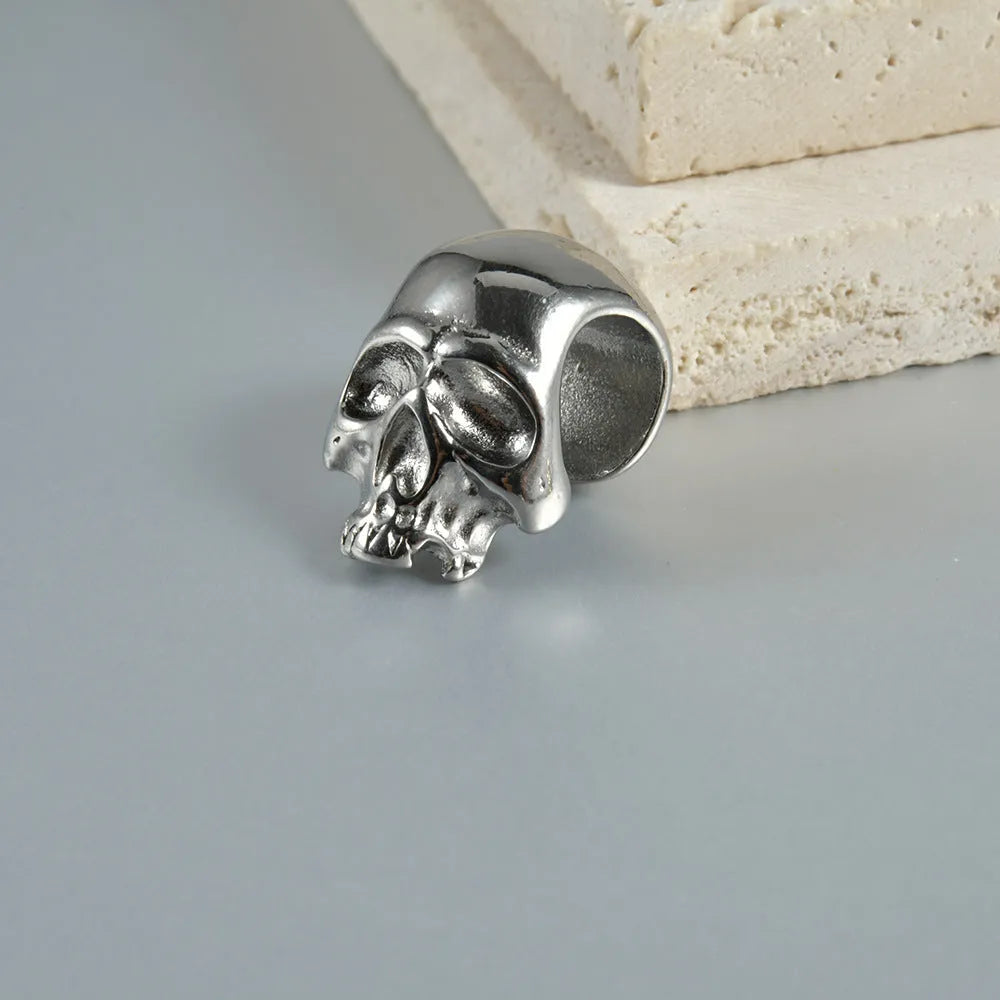 Stainless steel hollow skull Buddha earrings with geometric designs in four electroplated colour finishes