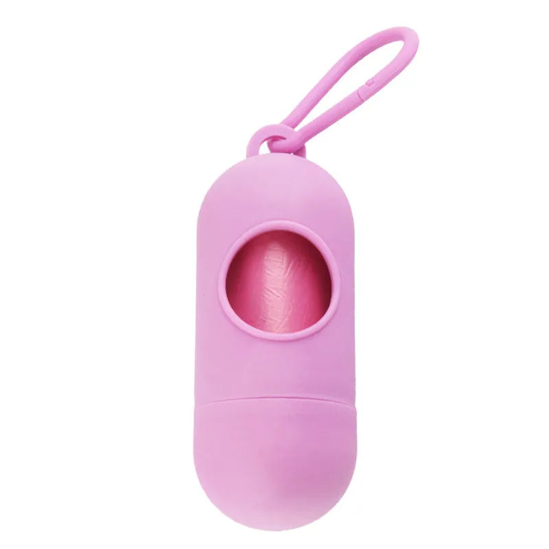 Compact black dog waste bag holder with side hook and velcro base for attaching to trousers or dog collars