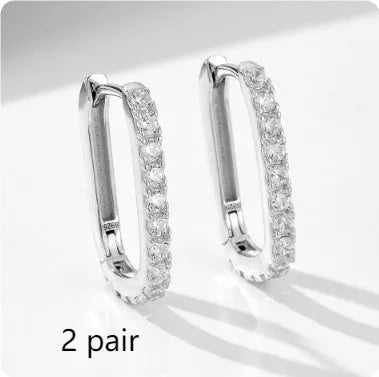 Sterling silver oval zircon ear clip earrings with geometric design in yellow and white options