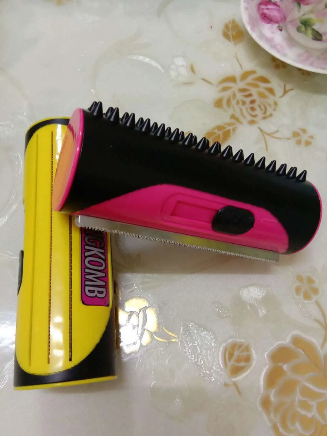 Red and yellow pet comb with stainless steel teeth and ABS plastic handle for dog and cat grooming