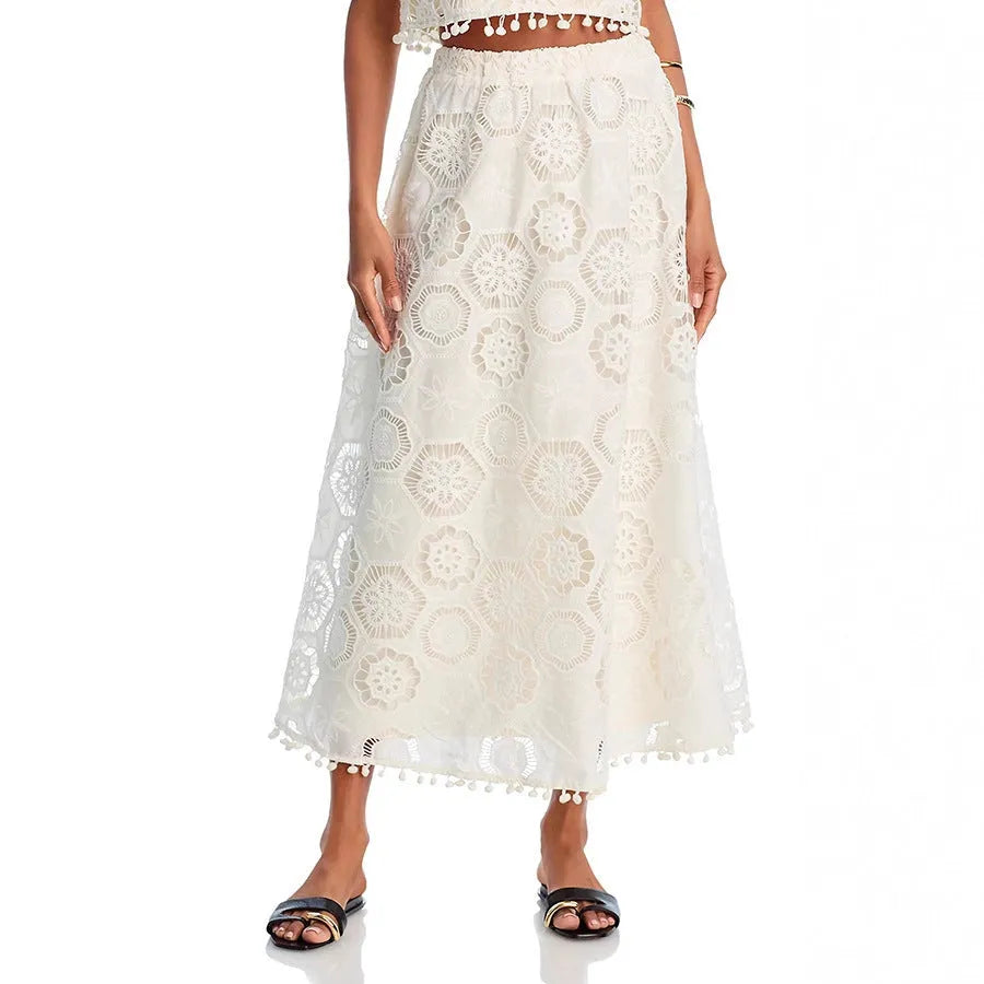 White women's sleeveless top and long skirt suit with retro embroidery detail on polyester fabric