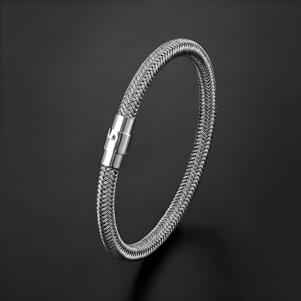 Titanium steel geometric wire bracelet with magnetic clasp on a wrist, showing unisex boyfriend style.