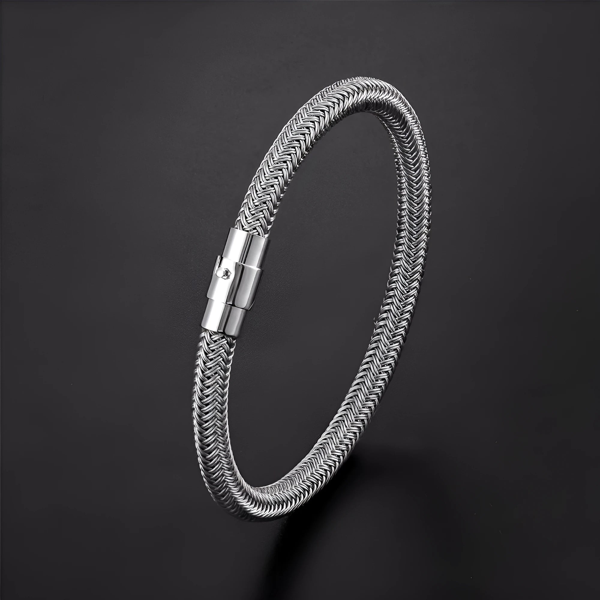 Titanium steel geometric wire bracelet with magnetic clasp on a wrist, showing unisex boyfriend style.