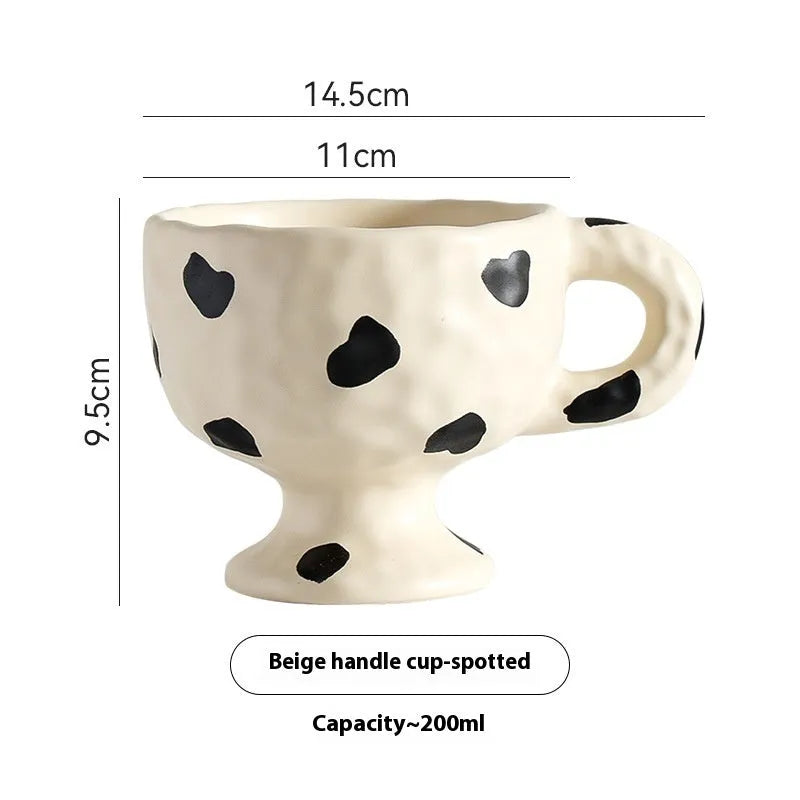 Hand-pinched irregular ceramic mug with solid colour design, approximately 14.5cm tall