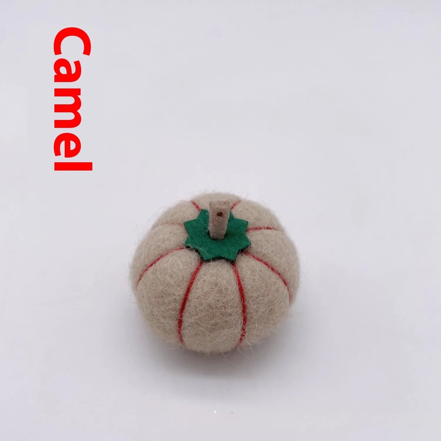Wool felt pumpkin ornament in assorted colours for dollhouse decoration, approx. 5cm wide.