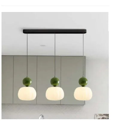 Nordic style pumpkin-shaped alloy chandelier for ceiling mounting in a bedroom or dining room.