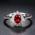 Women's blue moissanite ring with floral electroplated copper band and inlaid zirconium setting.