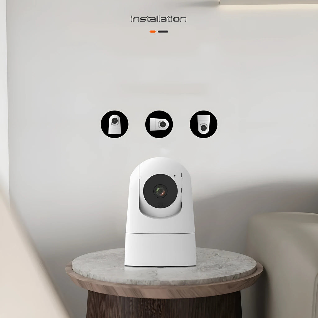 White indoor security camera with lens on a stand, showing compact design.