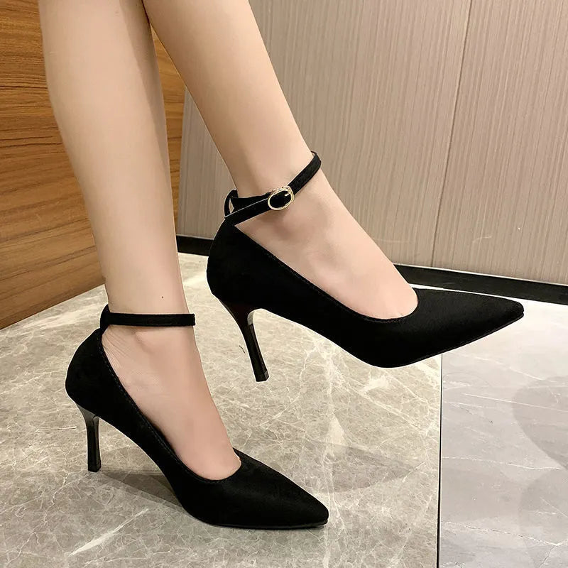 Women's black stiletto pump with buckle closure on 8cm heel