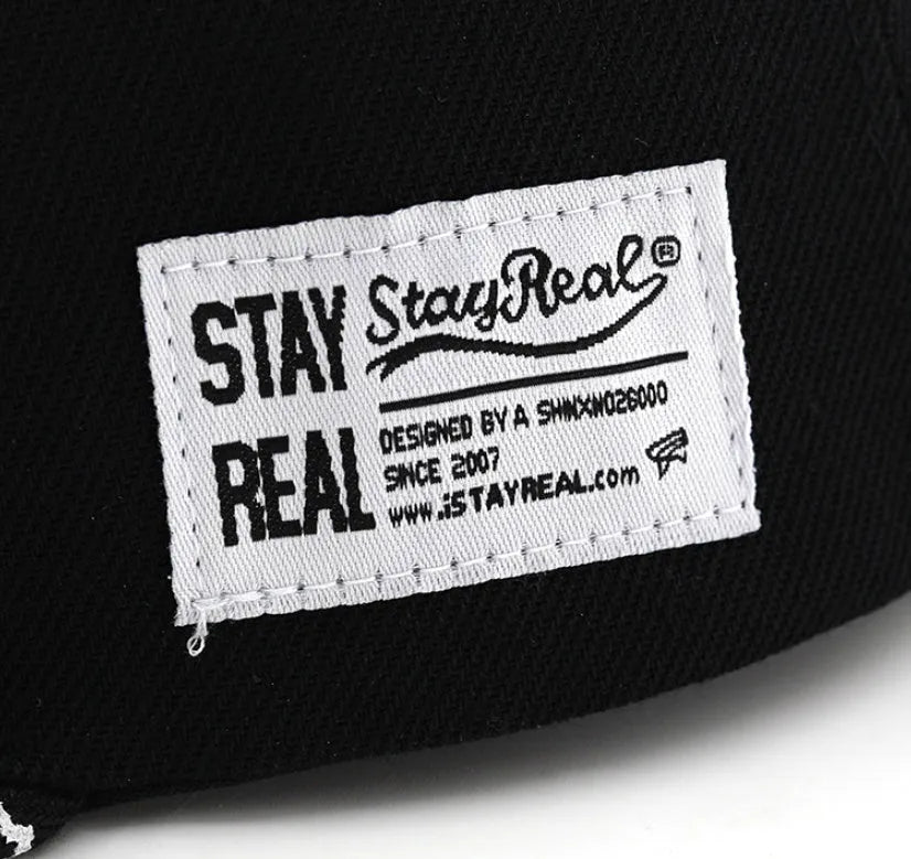 Cotton baseball cap with letter embroidery in black or white colours, showing adjustable strap and dome crown