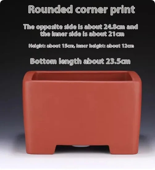 A square purple clay flower pot for succulents or bonsai plants on a tabletop.