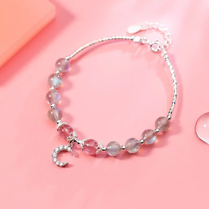 Natural moonstone adjustable bracelet with 6mm gemstone on wrist showing extension chain