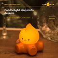 Silicone Small Fire Pile cartoon night lamp with yellow light on a surface