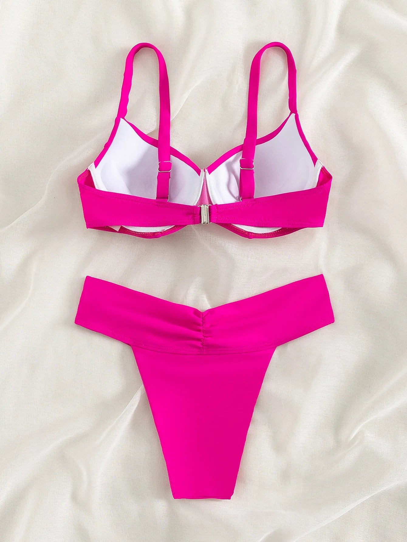Solid colour fluorescent bikini swimsuit set on a white background, showing bra top and briefs.