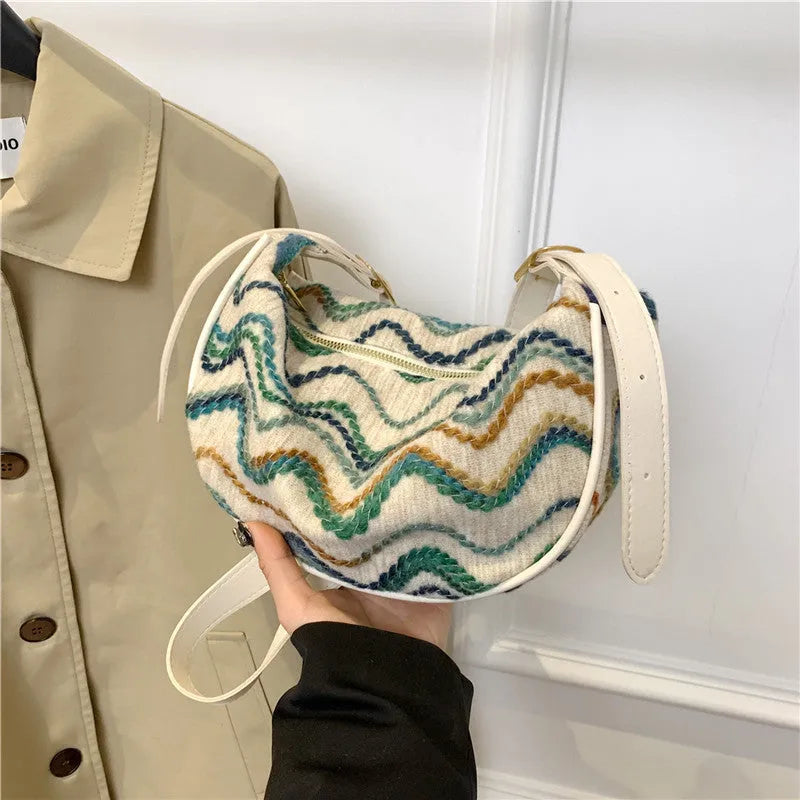 Women's straw woven crossbody bag with internal phone and document pockets in corrugated finish