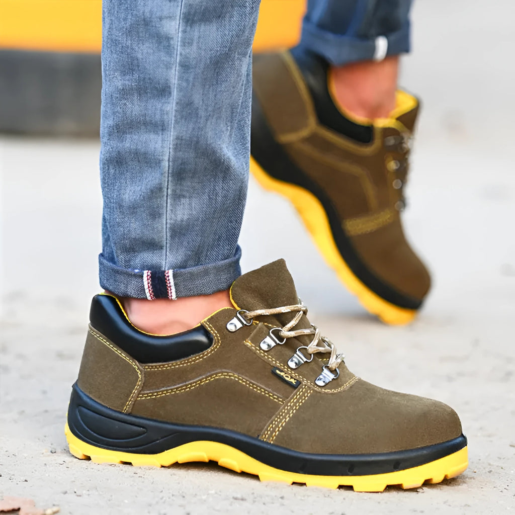 Bronze coloured low-cut steel toe safety boots with a cowhide suede upper and solid rubber sole.