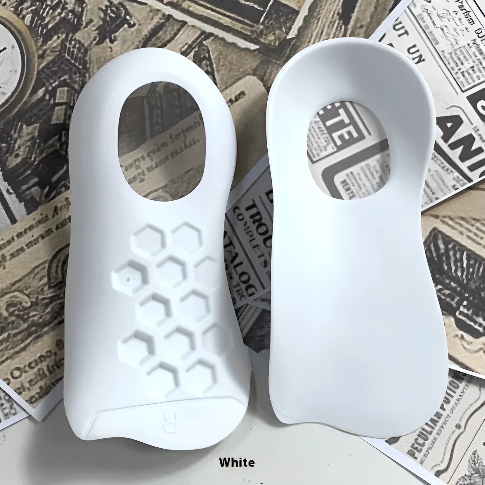 TPR arch support insoles for varus correction in white, black and skin colours