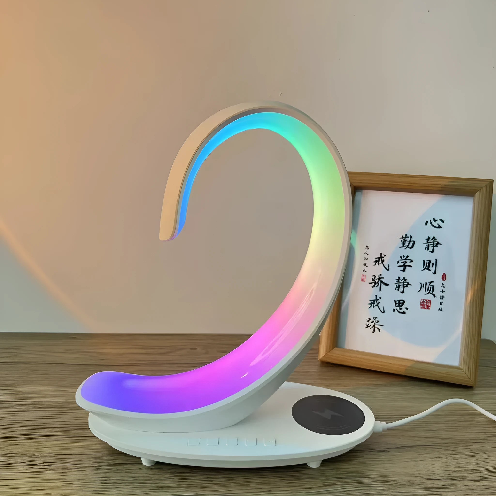 White swan shaped desktop lamp with wireless charging pad, Bluetooth speaker and colourful LED mood lighting