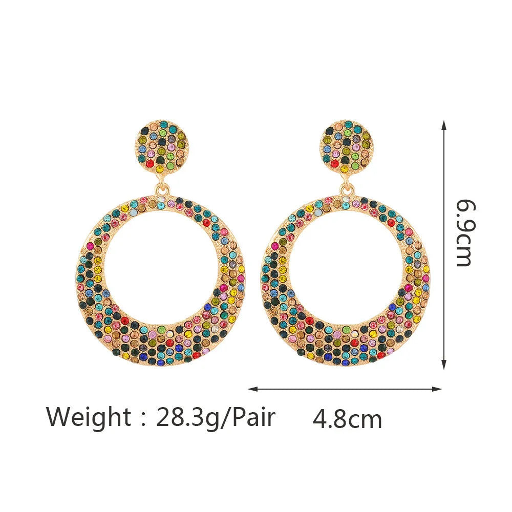 Colourful metal pendant earrings with diamond accents and cartoon style design