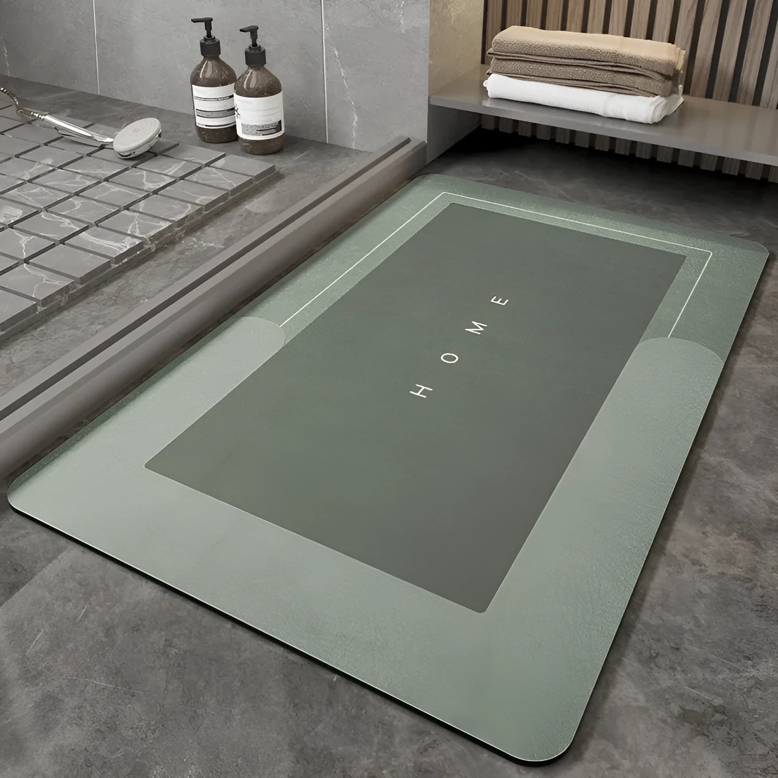 Blended fabric bathroom floor mat in blue colour, shown in an oval shape on a tiled floor.