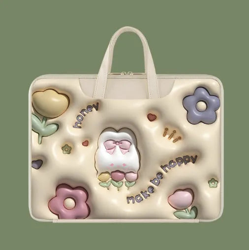 PU leather inflatable laptop bag with cartoon design, shown hanging from a suitcase handle.