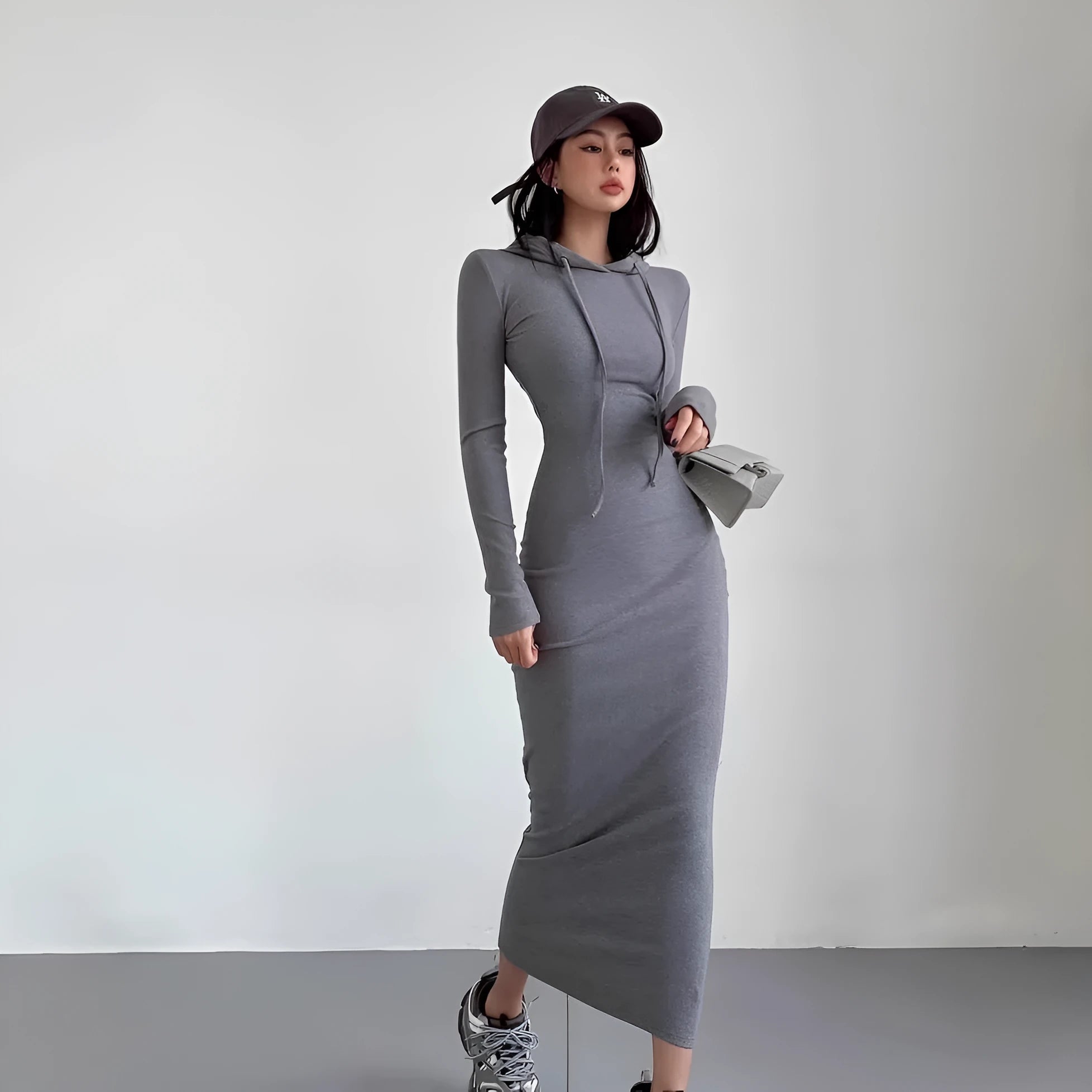 Women's grey hooded long sleeve sheath dress with a high waist and over-the-knee length.