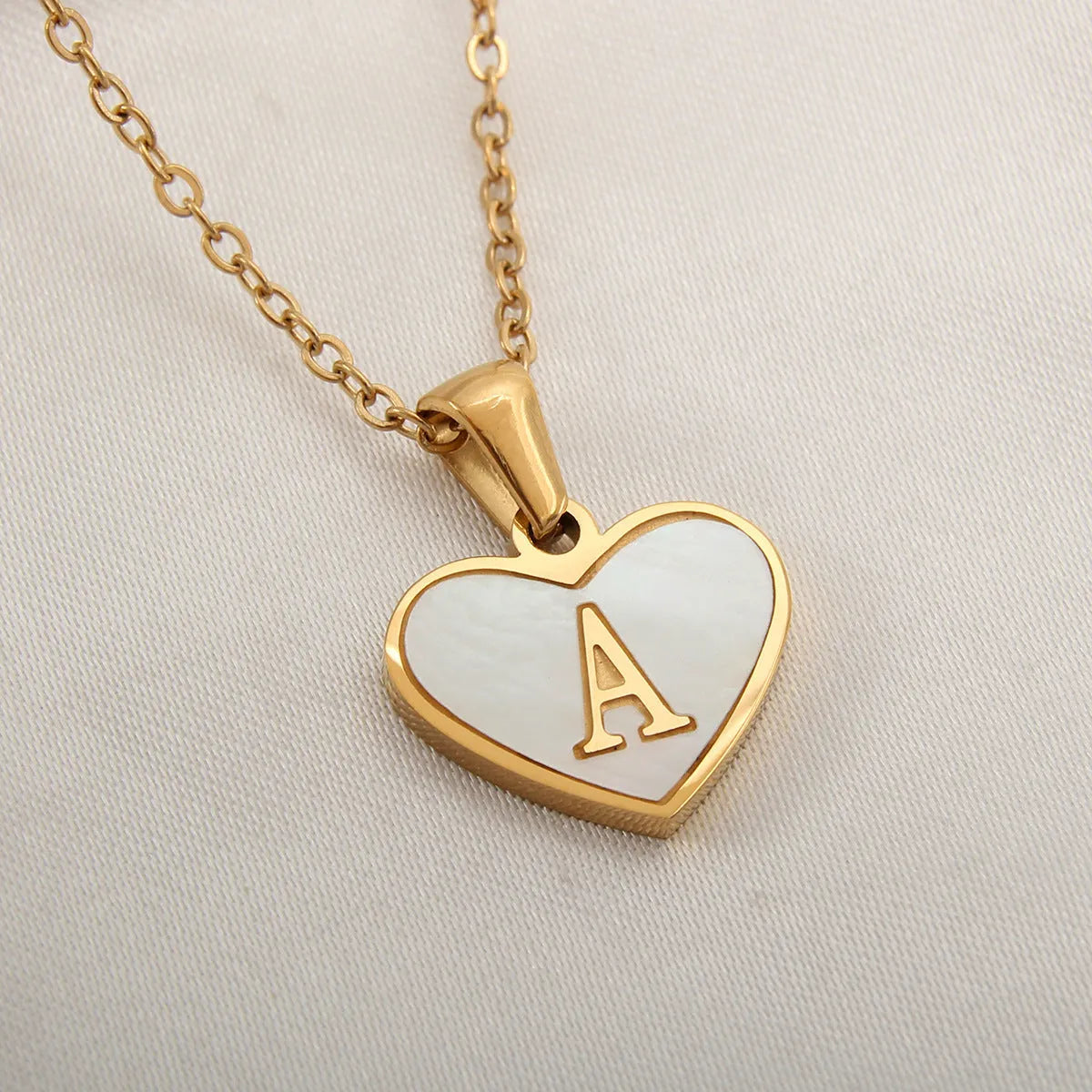 Gold plated personalised heart necklace with white shell on a 45cm chain