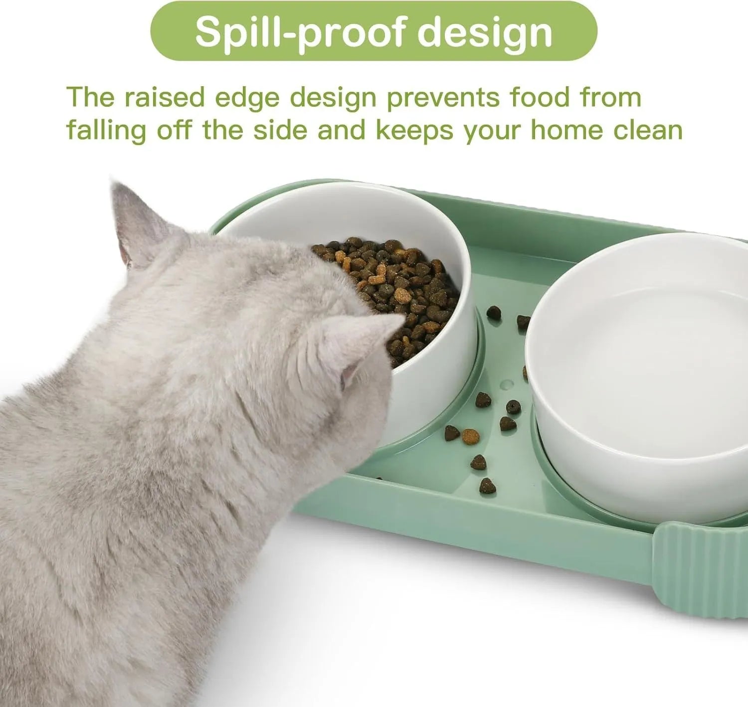 Green ceramic raised cat food and water bowls set with tilted stand on a kitchen floor.