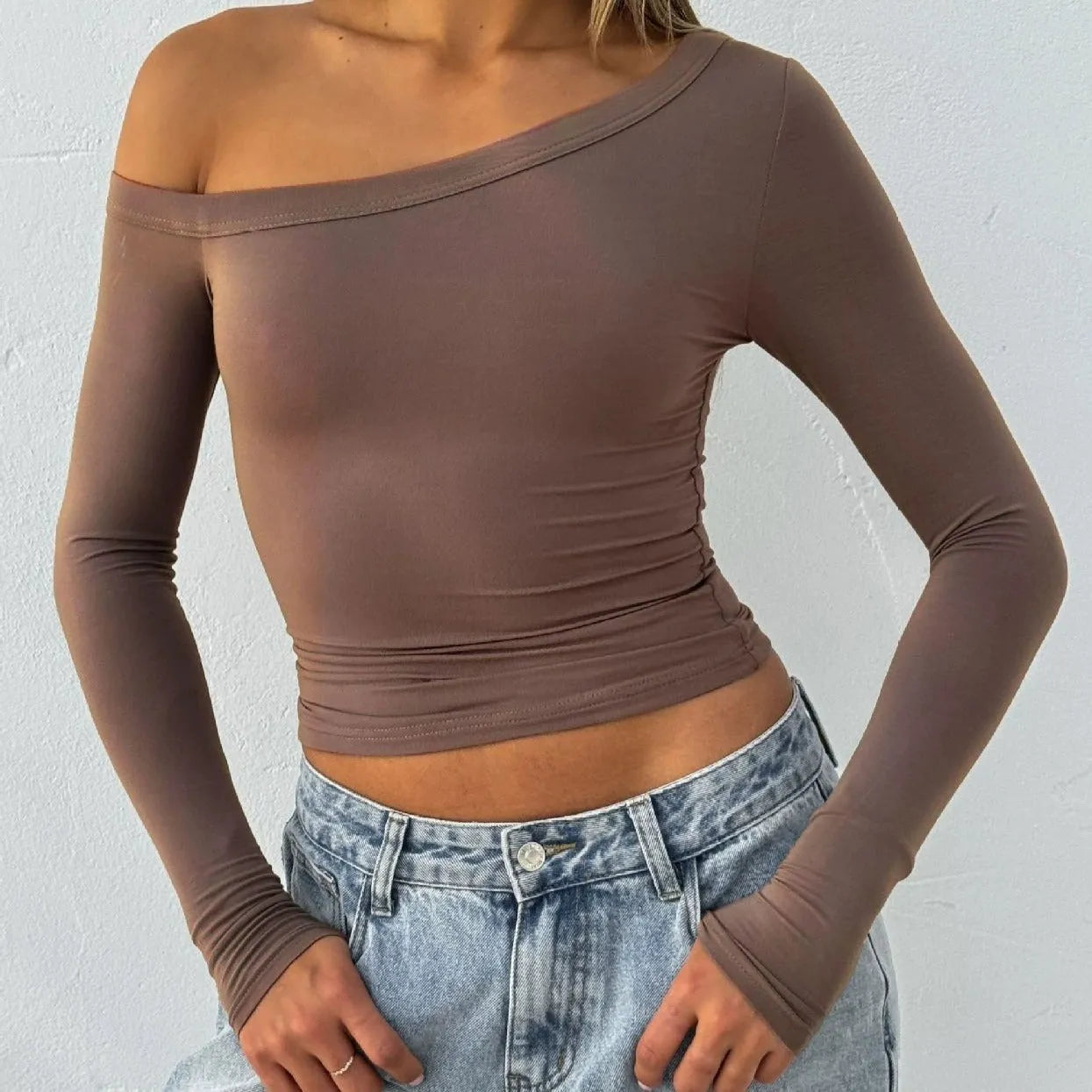 Women's solid colour knitted cardigan with cross shoulder straps and long sleeves