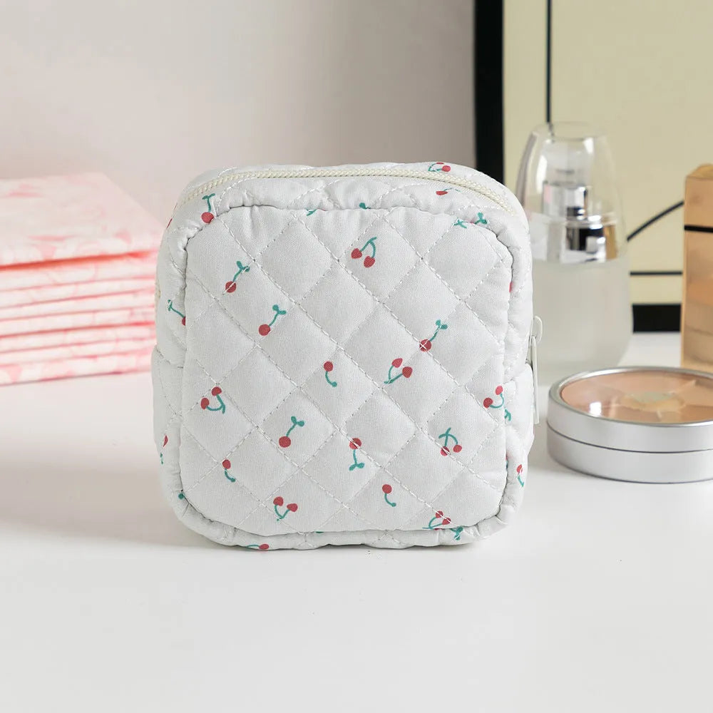 Floral polyester key storage bag with sewing thread detailing in multiple colour patterns